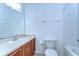 Bathroom featuring a tub, light vanity, and decorative mirror at 6255 Osprey Lake Cir, Riverview, FL 33578