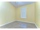 Neutral bedroom with tiled floors, natural light, and a clean, minimalist design at 6255 Osprey Lake Cir, Riverview, FL 33578