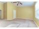 Spacious bedroom with lots of natural light, ceiling fan and closet at 6255 Osprey Lake Cir, Riverview, FL 33578