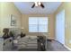 Comfortable bedroom featuring a twin bed, neutral decor, and soft lighting, creating a cozy and inviting space at 6255 Osprey Lake Cir, Riverview, FL 33578
