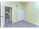 Bedroom featuring tiled floor, closet, and a view to other rooms in the property at 6255 Osprey Lake Cir, Riverview, FL 33578
