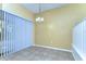 Cozy dining area with natural light from sliding doors and a chandelier at 6255 Osprey Lake Cir, Riverview, FL 33578