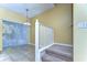 Bright dining area with sliding glass doors and a modern chandelier fixture at 6255 Osprey Lake Cir, Riverview, FL 33578