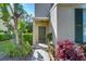 Charming front entrance with a well-maintained garden and freshly painted door at 6255 Osprey Lake Cir, Riverview, FL 33578