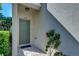Inviting front door with tile and a cozy entryway for guests and residents alike at 6255 Osprey Lake Cir, Riverview, FL 33578
