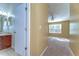 Hallway leading to the main bedroom and bathroom at 6255 Osprey Lake Cir, Riverview, FL 33578