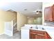 Open floor plan with a view of the kitchen, stairs, and a glimpse into the adjacent living area at 6255 Osprey Lake Cir, Riverview, FL 33578