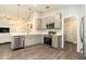 Beautiful modern kitchen equipped with stainless steel appliances and plenty of counter space for cooking at 6863 Hanworth Ln, Zephyrhills, FL 33541