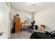 Office room with a work desk, carpeted floor, and natural light from a window at 6863 Hanworth Ln, Zephyrhills, FL 33541