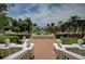 Beautiful exterior view showcasing manicured greenery and trees in a garden setting at 820 Druid S Rd, Clearwater, FL 33756
