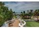 Expansive estate view featuring lush landscaping, manicured gardens, and architectural details overlooking the water at 820 Druid S Rd, Clearwater, FL 33756