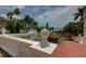 Manicured landscaping featuring white balustrade and fountain with waterfront view at 820 Druid S Rd, Clearwater, FL 33756