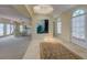 Spacious foyer with tile flooring, skylight, and views into the dining area, kitchen and water views at 820 Druid S Rd, Clearwater, FL 33756