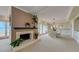 Spacious living room featuring a fireplace and access to waterfront balcony at 820 Druid S Rd, Clearwater, FL 33756