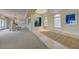 Bright living room featuring large windows with water views, comfortable seating, and modern decor at 820 Druid S Rd, Clearwater, FL 33756