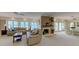 Spacious living room with water views, a fireplace, and neutral décor at 820 Druid S Rd, Clearwater, FL 33756
