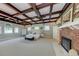Spacious main bedroom featuring tray ceiling, fireplace, large windows, and ceiling fans at 820 Druid S Rd, Clearwater, FL 33756