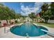 Expansive backyard with a sparkling pool, garden, and white gazebo at 820 Druid S Rd, Clearwater, FL 33756
