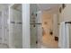 Walk-in shower with glass door and tile surround in updated bathroom at 820 Druid S Rd, Clearwater, FL 33756
