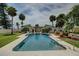Stunning backyard showcasing a sparkling pool, lush landscaping, and classic architecture at 820 Druid S Rd, Clearwater, FL 33756