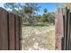 Charming gated entrance leading to a beautiful property, offering privacy and a glimpse of the natural surroundings at 8390 39Th N Ave, St Petersburg, FL 33709