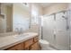 Bathroom featuring a glass door shower and modern vanity at 9224 Lost Mill Dr, Land O Lakes, FL 34638
