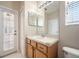 Bright bathroom featuring a large mirror and modern sink at 9224 Lost Mill Dr, Land O Lakes, FL 34638