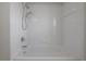 Bathroom featuring a white tiled shower and tub combination at 9224 Lost Mill Dr, Land O Lakes, FL 34638
