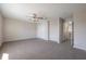 Spacious bedroom with ceiling fan, plush carpet, and ample natural light at 9224 Lost Mill Dr, Land O Lakes, FL 34638