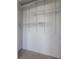 Walk-in closet with installed white shelving and neutral carpet at 9224 Lost Mill Dr, Land O Lakes, FL 34638