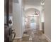 View from the front door that showcases the foyer, arched doorways and tiled floors at 9224 Lost Mill Dr, Land O Lakes, FL 34638