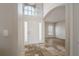 The foyer features tiled floors, a high ceiling, and access to other rooms at 9224 Lost Mill Dr, Land O Lakes, FL 34638