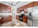 Well-equipped kitchen featuring matching black appliances and dark wood cabinetry at 9224 Lost Mill Dr, Land O Lakes, FL 34638
