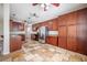 Spacious kitchen with stainless steel refrigerator, island, and ample cabinet space at 9224 Lost Mill Dr, Land O Lakes, FL 34638