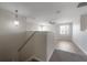 Second-floor living room featuring hardwood floors, a ceiling fan, and lots of natural light at 9224 Lost Mill Dr, Land O Lakes, FL 34638
