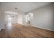 Spacious living room features hardwood floors and arched entries leading to other rooms at 9224 Lost Mill Dr, Land O Lakes, FL 34638