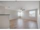 Spacious second-floor living room featuring hardwood floors and lots of natural light at 9224 Lost Mill Dr, Land O Lakes, FL 34638