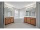 Main bathroom with a large corner tub and double sinks, creating a relaxing space at 9224 Lost Mill Dr, Land O Lakes, FL 34638