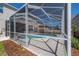 Home's exterior features an enclosed pool and screened-in lanai, enhancing outdoor living at 9224 Lost Mill Dr, Land O Lakes, FL 34638