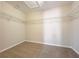 A walk-in closet with carpet and shelving, providing storage and organization at 9224 Lost Mill Dr, Land O Lakes, FL 34638