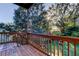 Covered back porch overlooking lush green yard with sun shining through the trees at 510 Pine S Ave, Oldsmar, FL 34677