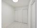 Bright bedroom featuring marble floors, ample closet space, and fresh paint at 1012 Cronley Pl, Sarasota, FL 34237