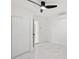 Bright bedroom with ensuite bathroom, sleek ceiling fan and closet at 1012 Cronley Pl, Sarasota, FL 34237