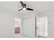 Bright bedroom with ensuite bathroom, sleek ceiling fan and closet at 1012 Cronley Pl, Sarasota, FL 34237