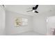 Bright bedroom featuring ensuite bathroom, and ceiling fan at 1012 Cronley Pl, Sarasota, FL 34237