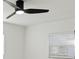 Bedroom showcasing a modern ceiling fan and natural light from a window at 1012 Cronley Pl, Sarasota, FL 34237