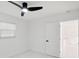 Bright bedroom with a modern ceiling fan, marble floors, and natural light at 1012 Cronley Pl, Sarasota, FL 34237