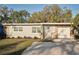 Charming single-story home with stone accents, fresh exterior paint, and well-manicured landscaping at 1012 Cronley Pl, Sarasota, FL 34237