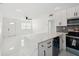 Bright kitchen with granite countertops, stainless steel appliances, and open layout for easy entertaining at 1012 Cronley Pl, Sarasota, FL 34237