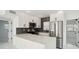 Modern kitchen featuring stainless steel appliances, granite countertops, and open layout at 1012 Cronley Pl, Sarasota, FL 34237
